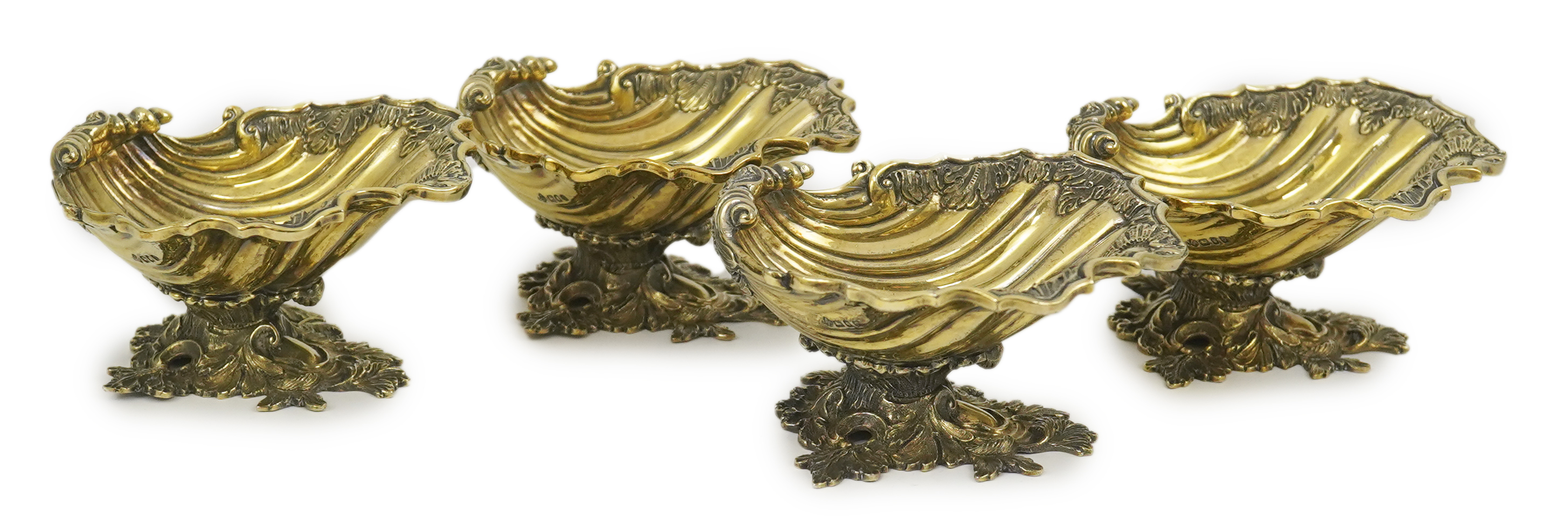 A set of Elizabeth II Victorian style silver gilt pedestal shell salts, by Asprey & Co Ltd